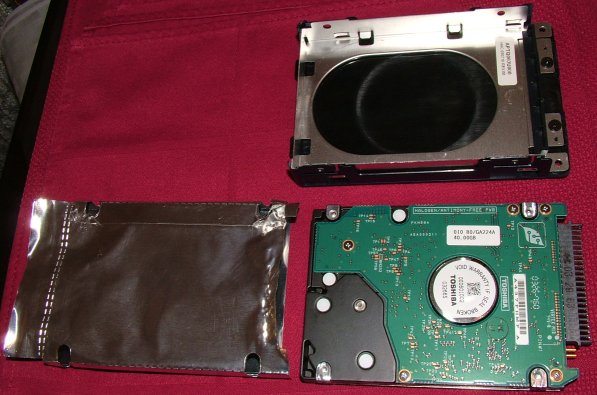 Old drive with bracket and shield removed